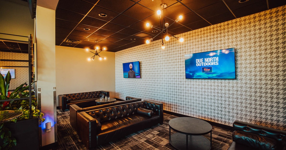 Interior, seating area, TVs on the walls