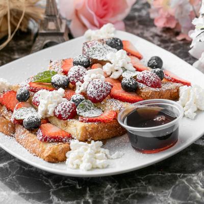 French Toast, with berries, whipped cream, and maple syrup