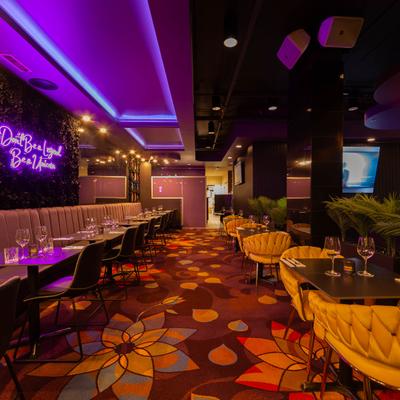 Interior, spacious seating room, tableware on tables.