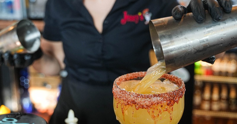 Bartender pouring a Margarita