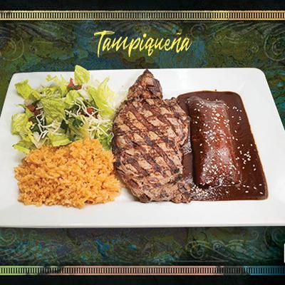 Grilled beef steak served with cheese enchilada, rice and salad.