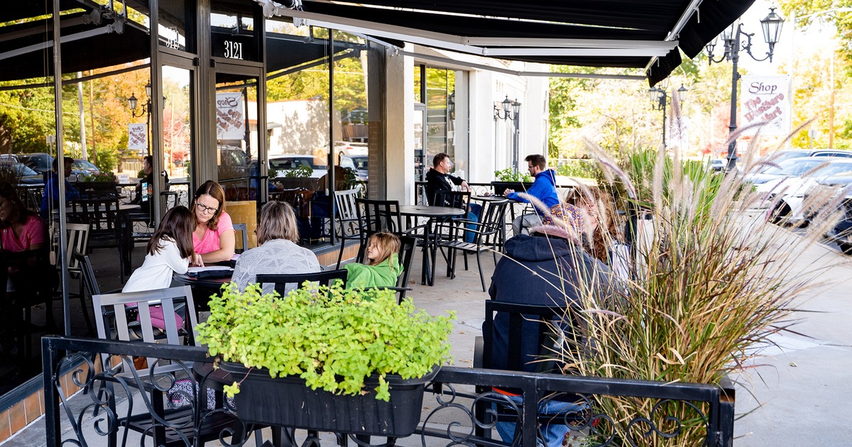 Covered patio with tables and chairs