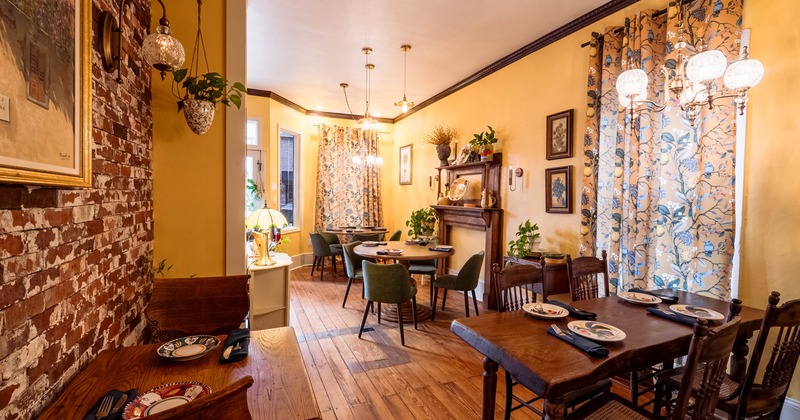 Interior, dining area, wooden tables and chairs, ready for guests, wooden flooring