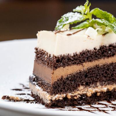 A close up of a slice of mocha chocolate mousse cake.