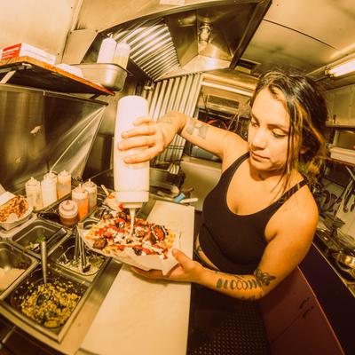 A kitchen worker preparing food