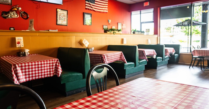 Interior of cozy dining area with upholstered dining booths
