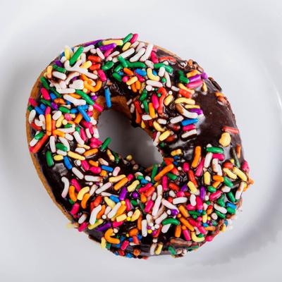 Chocolate Old Fashioned donut with sprinkles.