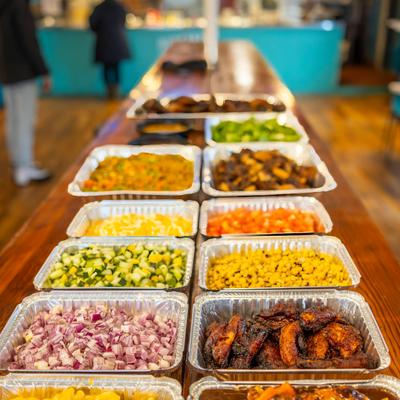 Various self-serving containers filled with food.