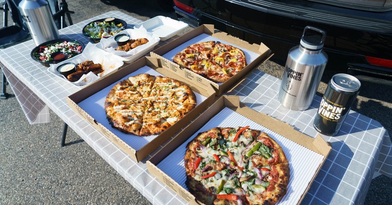 Pizzas, chicken wings, and salads