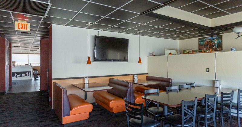 Interior, bench seating with tables and tables with chairs