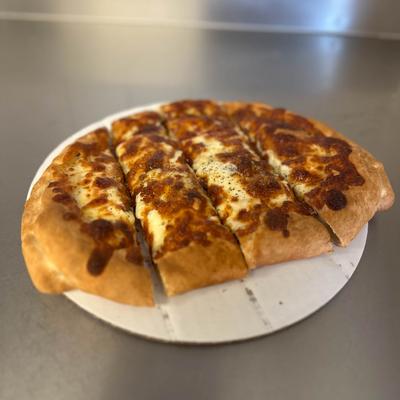 Golden brown cheese-stuffed bread cut into five slices on a white plate.