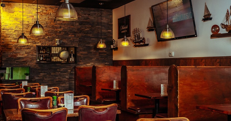 Interior, seating area with tables, chairs and booths
