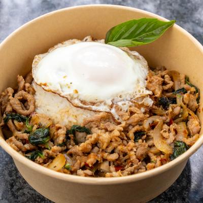 Stir fried minced meat with basil, chili garlic sauce, onions, fried egg, and rice.