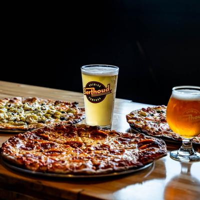 Various pizzas and beer.