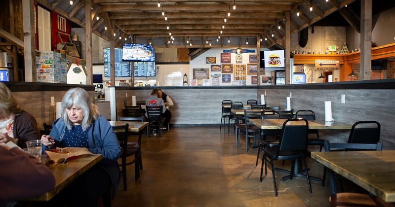 Interior, dining tables, guests enjoying their food