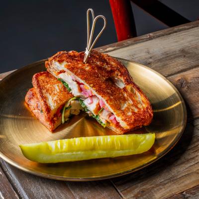 Grilled panini with Gouda cheese and grilled chicken.