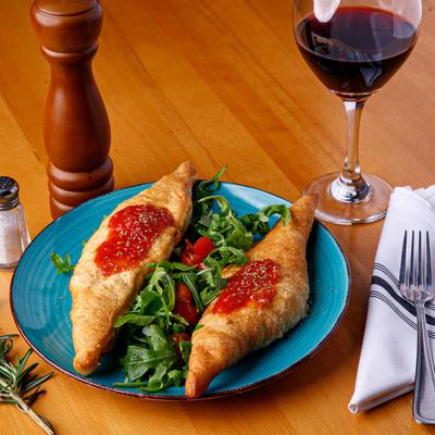 Pastry and red dip on top