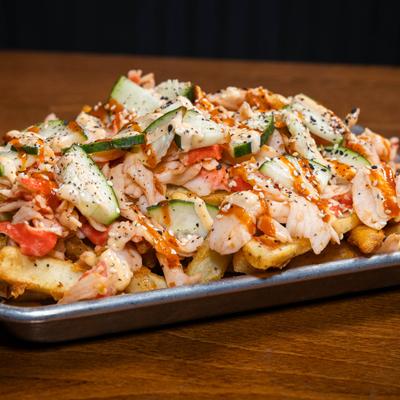 Loaded fries topped with spicy crab salad, sriracha, and spicy mayo.