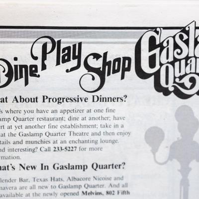 A newspaper clipping featuring text with a headline 'Dine, Play, Shop'
