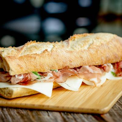 Speck on baguette with manchego cheese.