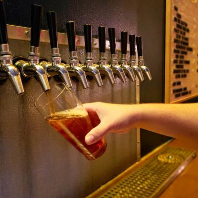 Pouring a glass of beer from the tap.