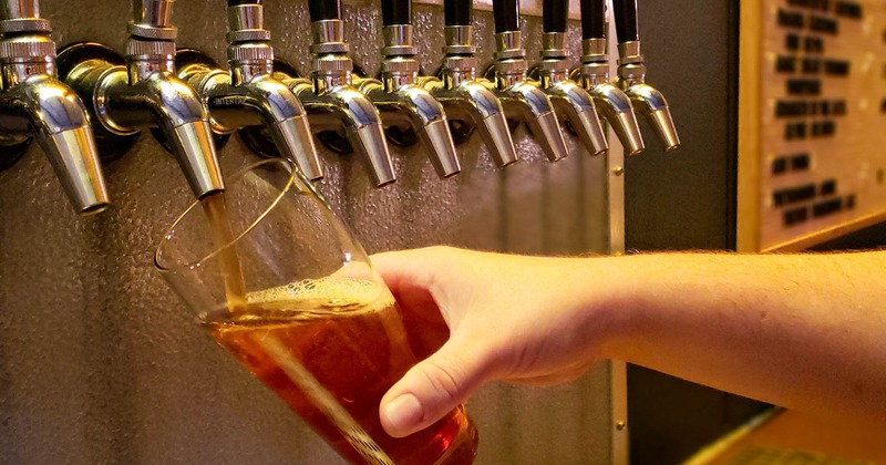 Pouring a glass of beer from the tap