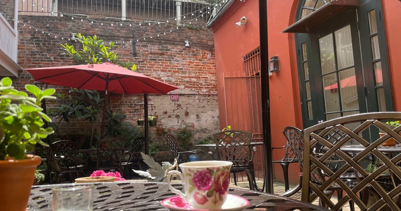 Outdoor patio scene, seating space surrounded by building walls
