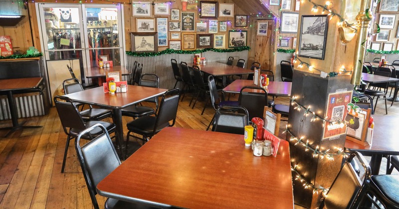 Interior seating space with chairs and tables, wall decoration