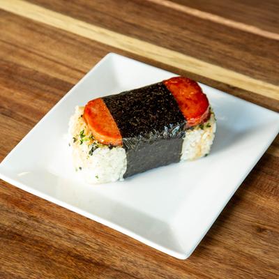 Spam musubi on a square white plate