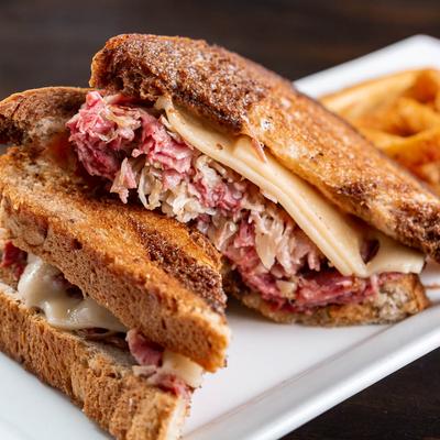 Reuben sandwich with fries.
