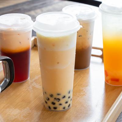 Thai milk tea with tapioca bubbles served alongside other beverages.