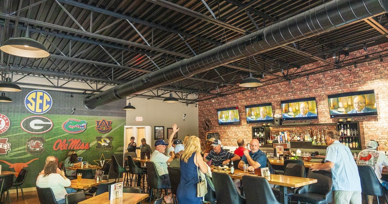 Interior, wide view to the diner and bar area, guests, tables and chairs