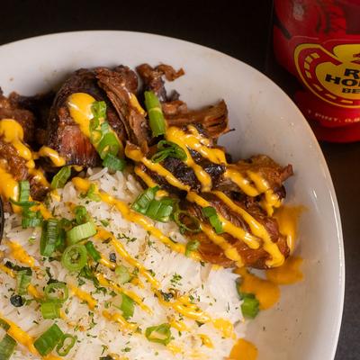 Red rice bowl with pork adobo.