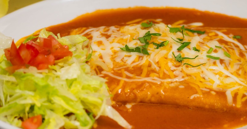 Rolled tacos with cheese topping