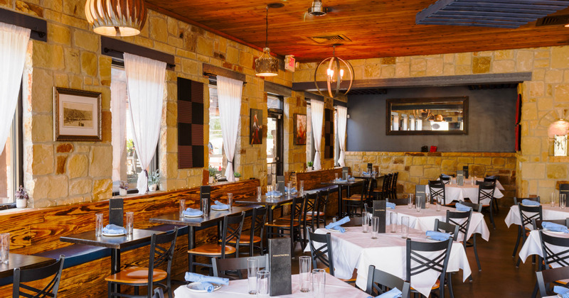 Interior, dining area with guest tables, hairs and bench seats