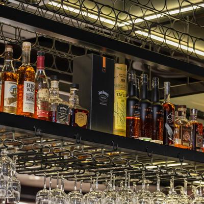 Strong drinks on the top shelf.