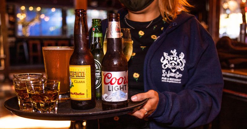 Staff member serving drinks