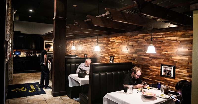 Interior, customers dining in restaurant booths