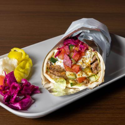 Lamb gyro wrap, with tomato, cucumber, pickled red cabbage, and tzatziki.