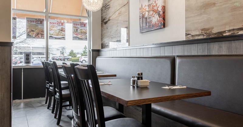 Interior, banquette seating area, tables and chairs