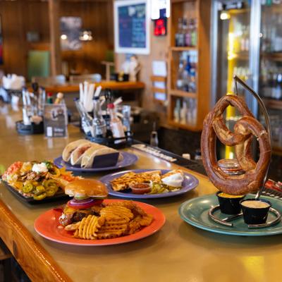 Assortiment of dishes served on a bar counter.
