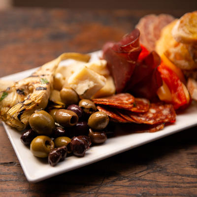 Olives, pepperoni and prosciutto plate