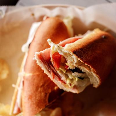 Italian Sub with ham, salami, capicola, mozzarella, lettuce, tomatoes, onions and olives.