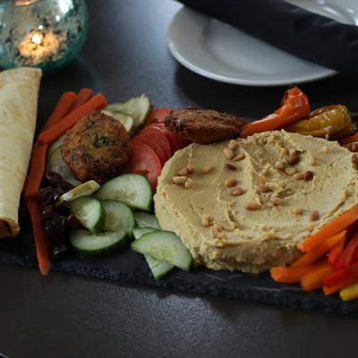 Hummus, falafel, roasted veggies, and bread.