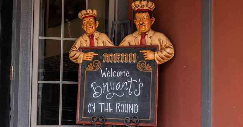 Welcome Bryant's On The Round written on a chalkboard