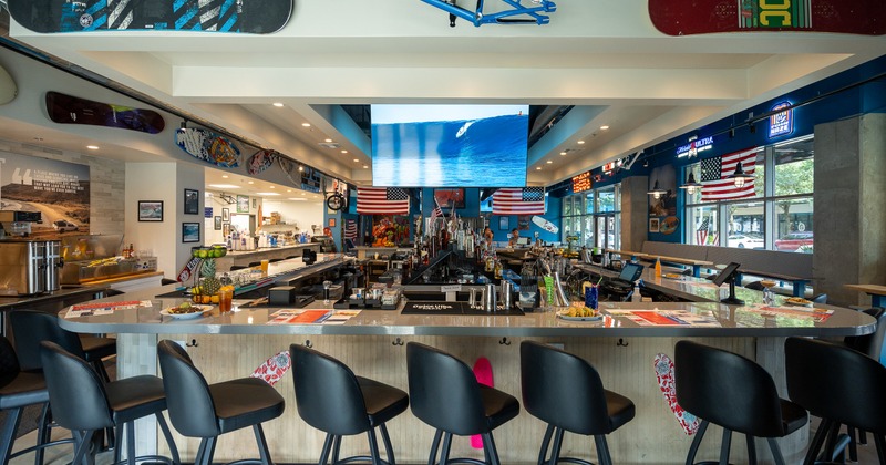 Diner bar, stools, screen above