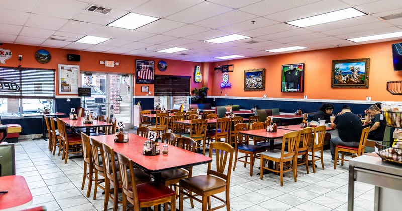 Interior, dining area with wooden tables and chairs