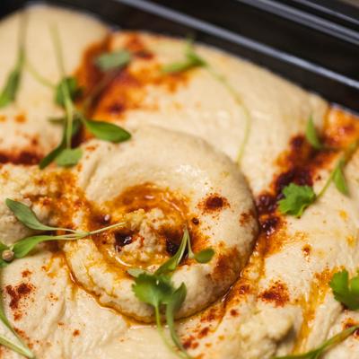 Hummus served, closeup.
