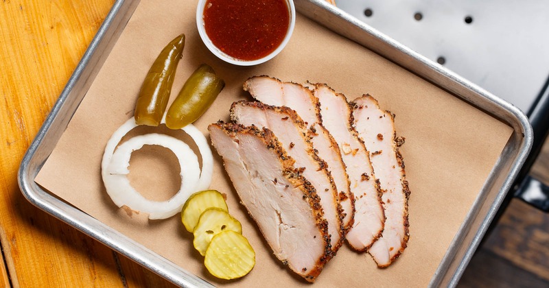 Different types of grilled meat, bread and salad on the side