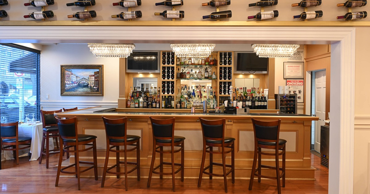Bar with upholstered bar stools